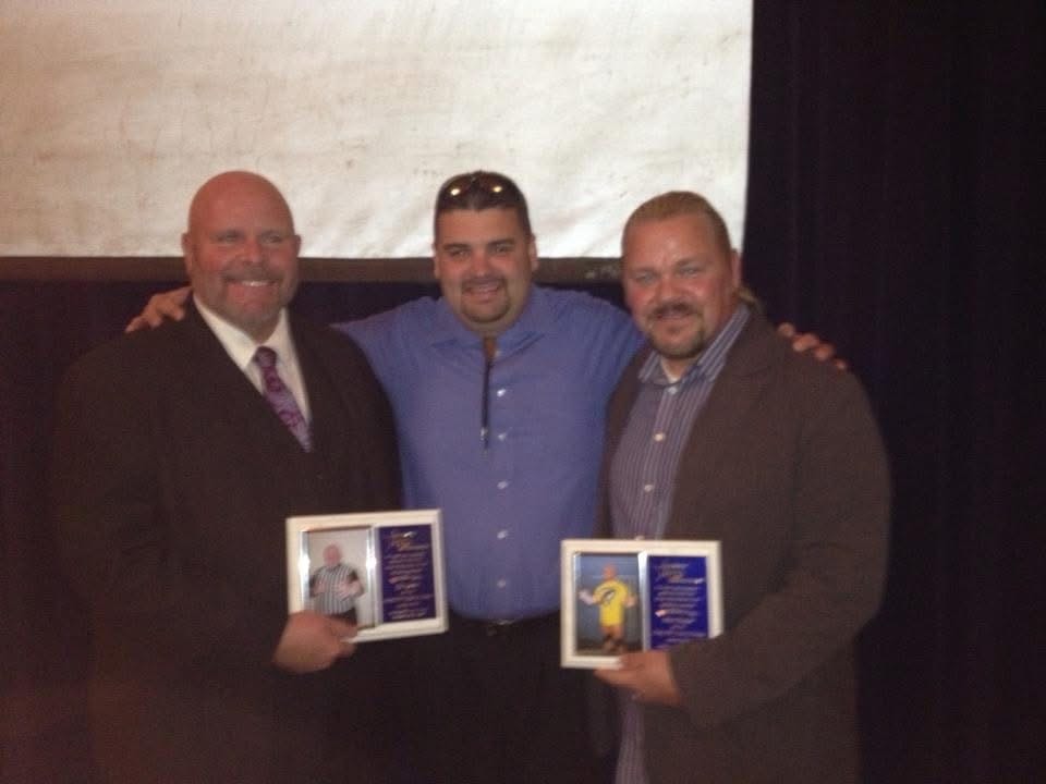 Hall of Fame induction ceremony — Pat Lawson (left) and Shane Douglas (right) holding their induction plaques