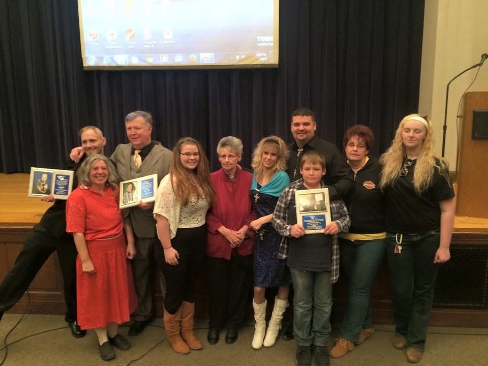 Hall of Fame induction ceremony — Crazii Shea and Richie White in the back row far left, with members of the Covey family holding the plaque for Roy 'Pap' Covey, inducted posthumously