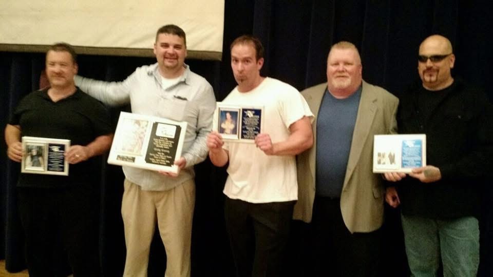 Hall of Fame induction ceremony — Larry McLuvin (far left), Cody Covey (second from left), Bazooka Joe (center), Greg "The Magistrate" Miller (second from right), and Venom (far right) holding their induction plaques